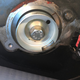This is the cam-side of the hall sensor, a cup with an opening to trip the magnet on the other side.